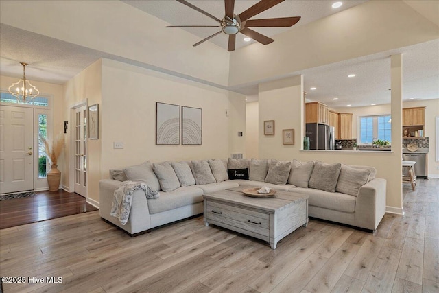 122 Smathers Dr, West End, NC 27376 - living room featuring a ceiling fan, light wood-style flooring, a chandelier, recessed lighting, and baseboards