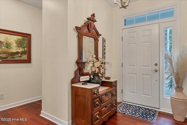 122 Smathers Dr, West End, NC 27376 - foyer featuring dark wood-style flooring, baseboards, and a chandelier