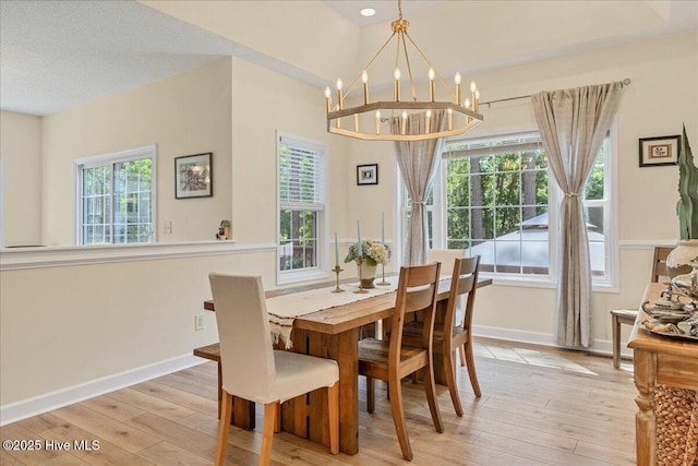 122 Smathers Dr, West End, NC 27376 - dining area with light wood-style floors, baseboards, and a chandelier