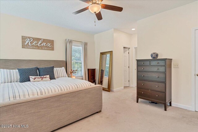 122 Smathers Dr, West End, NC 27376 - bedroom with light colored carpet, baseboards, and ceiling fan