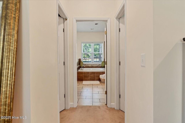 122 Smathers Dr, West End, NC 27376 - hall with light colored carpet and light tile patterned flooring