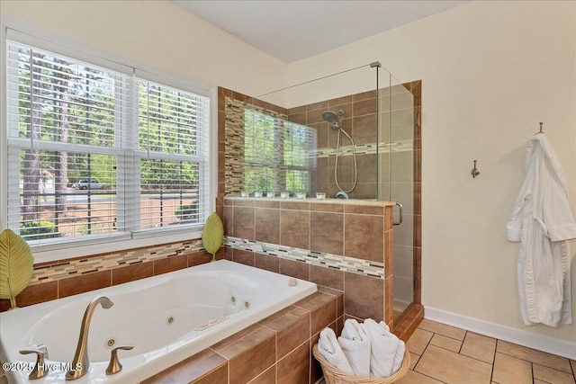 122 Smathers Dr, West End, NC 27376 - bathroom featuring a stall shower, tile patterned floors, a tub with jets, baseboards, and healthy amount of natural light