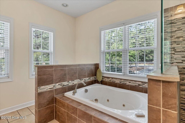 122 Smathers Dr, West End, NC 27376 - full bathroom featuring plenty of natural light, tile patterned floors, a tub with jets, and baseboards