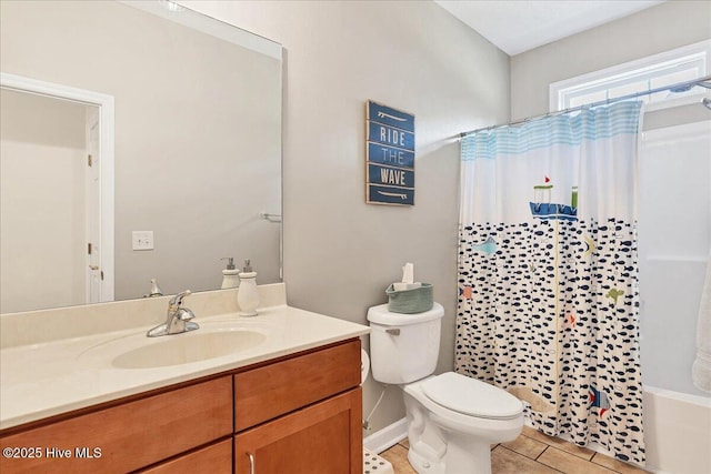 122 Smathers Dr, West End, NC 27376 - full bathroom featuring tile patterned floors, vanity, toilet, and shower / bath combination with curtain