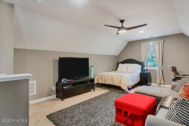 122 Smathers Dr, West End, NC 27376 - bedroom with lofted ceiling, carpet flooring, a textured ceiling, baseboards, and a ceiling fan
