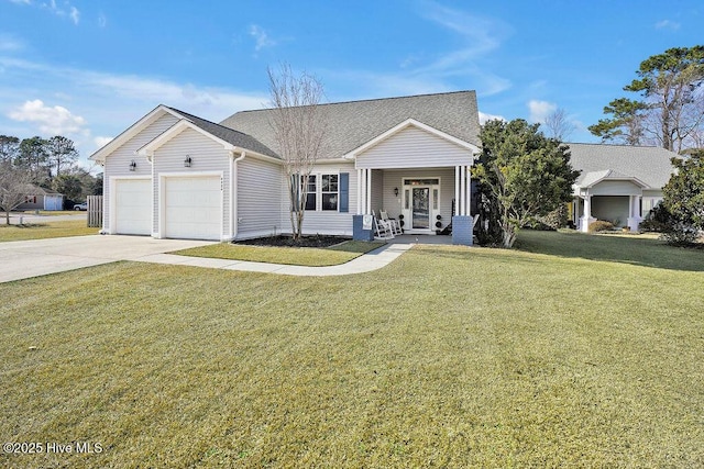 view of front of property with a shingled roof, an attached garage, driveway, and a front lawn