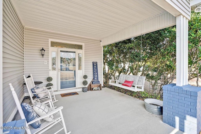 view of patio featuring a porch