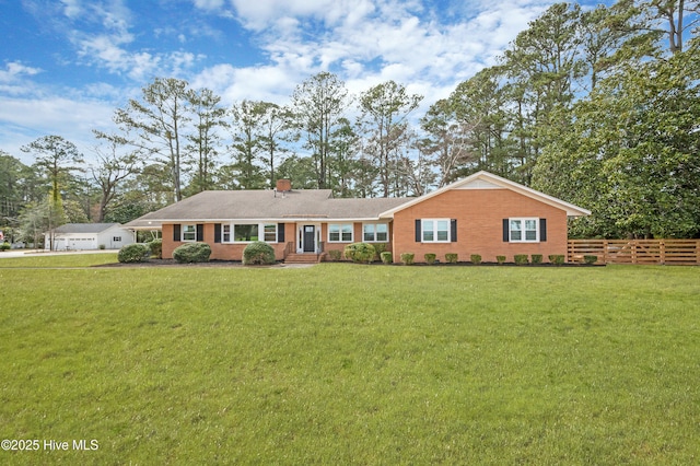 ranch-style house with a garage, a chimney, a front yard, and fence