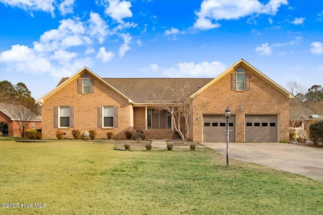 view of front facade featuring a front lawn, concrete driveway, and brick siding