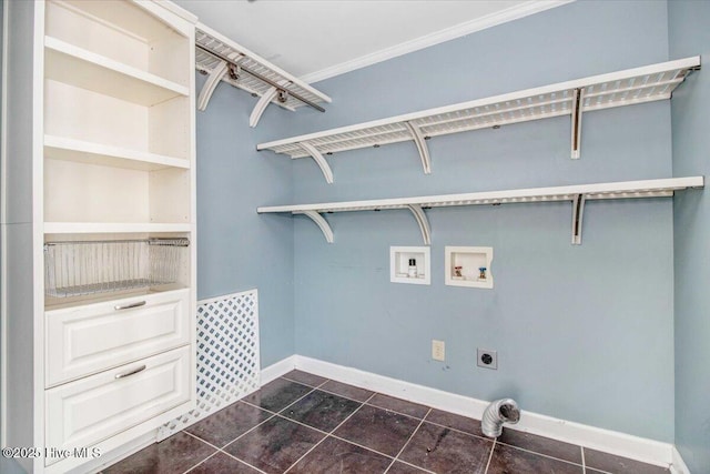 clothes washing area featuring laundry area, baseboards, hookup for an electric dryer, dark tile patterned floors, and washer hookup