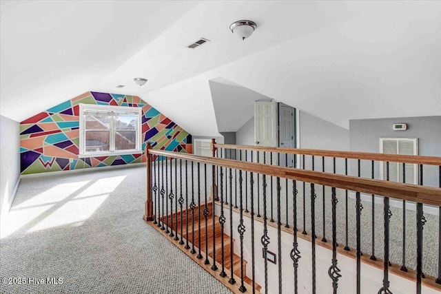 game room featuring lofted ceiling, carpet floors, and visible vents