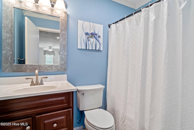 full bathroom featuring vanity, toilet, and ornamental molding