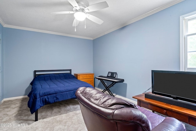 bedroom with baseboards, ceiling fan, carpet flooring, and crown molding