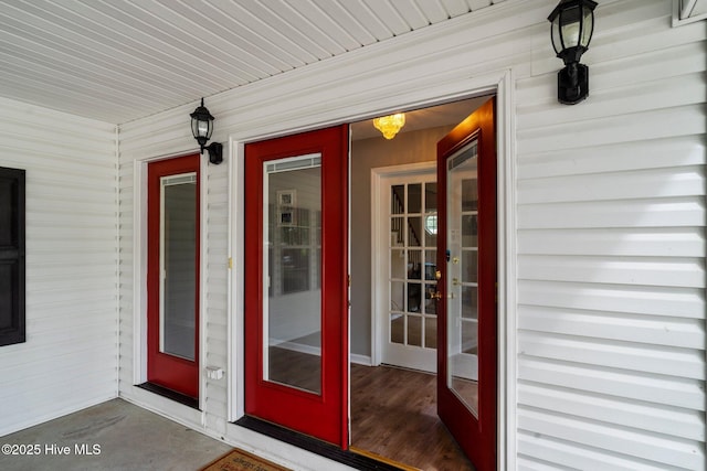 view of exterior entry with covered porch