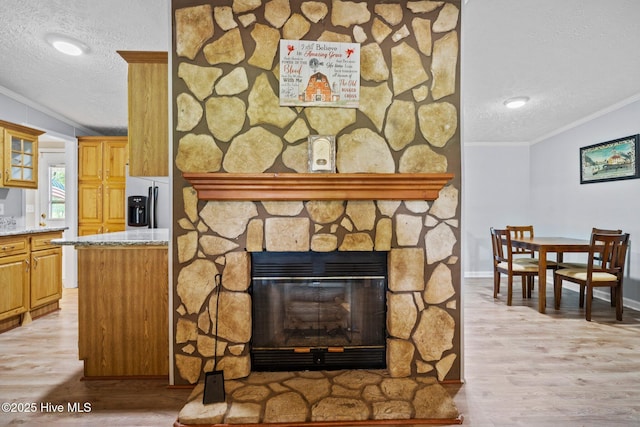 details with a textured ceiling, crown molding, and wood finished floors