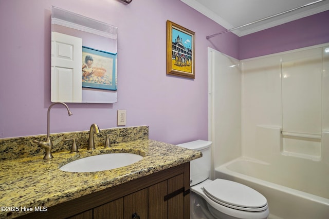 bathroom with vanity, crown molding, toilet, and shower / bathing tub combination