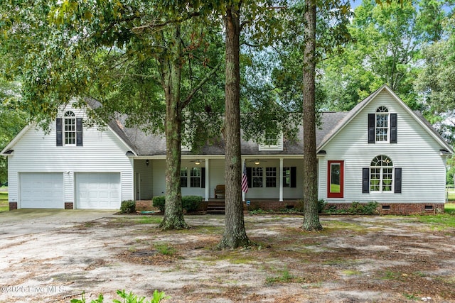 view of front facade featuring crawl space, roof with shingles, a porch, and a garage