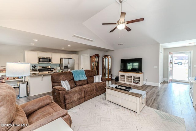 living area featuring recessed lighting, a ceiling fan, wood finished floors, high vaulted ceiling, and baseboards