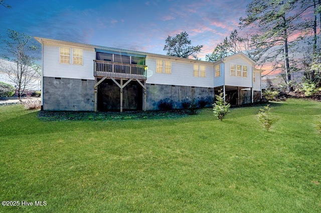 rear view of house with a yard