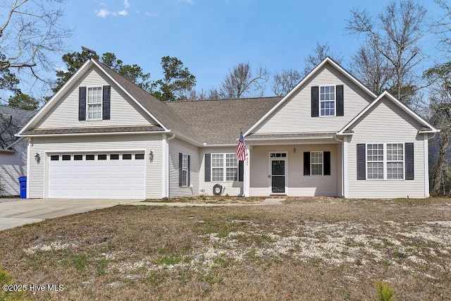 traditional home with a garage and concrete driveway