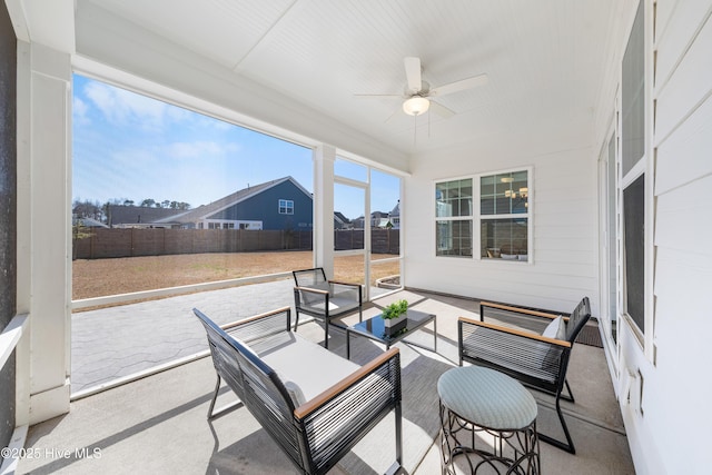 sunroom with a ceiling fan