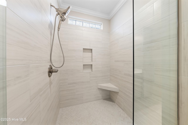 bathroom featuring a stall shower and crown molding