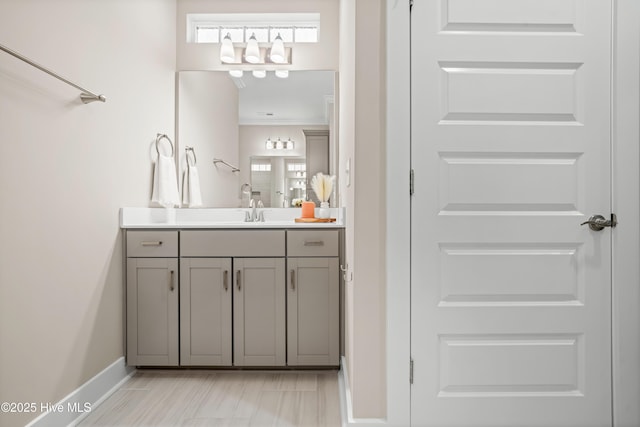 bathroom featuring vanity and baseboards