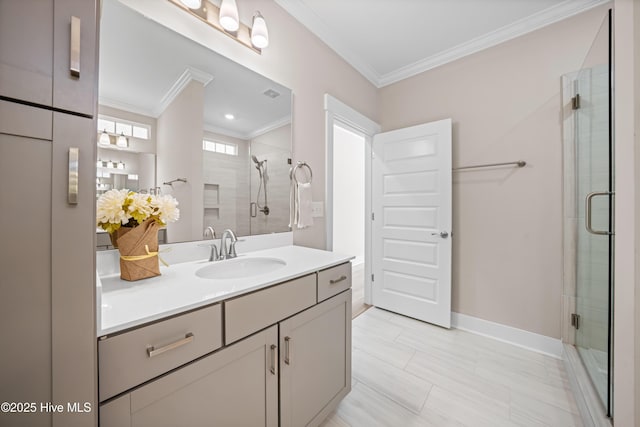 full bathroom featuring ornamental molding, baseboards, a shower stall, and vanity