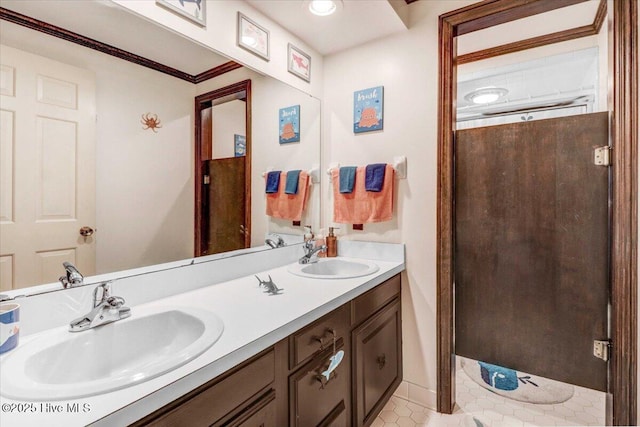 bathroom with a sink and double vanity