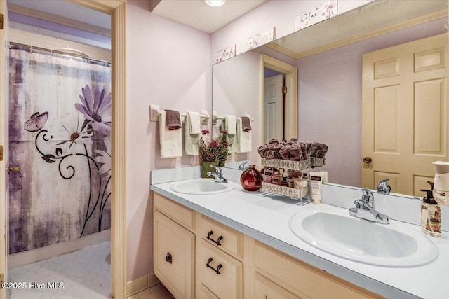 full bathroom with double vanity, a shower with shower curtain, and a sink