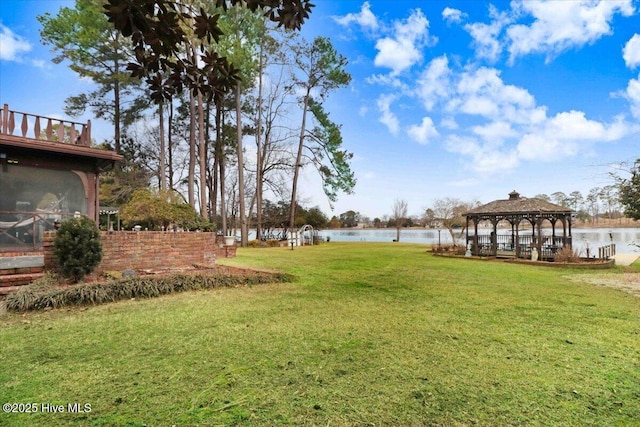 view of yard with a water view and a gazebo