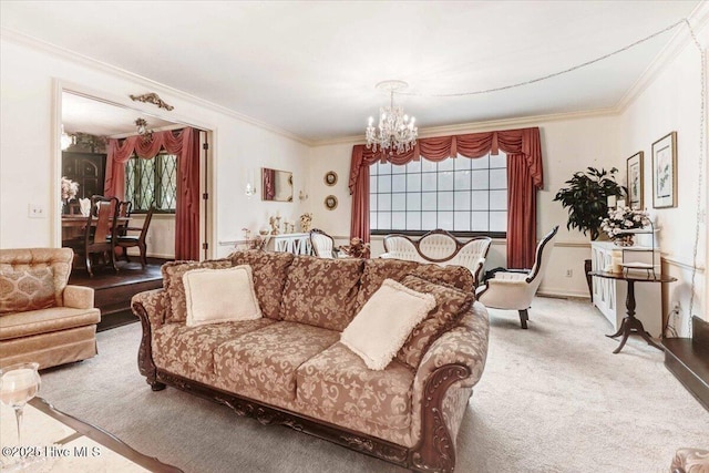 living area with a healthy amount of sunlight, a chandelier, crown molding, and light colored carpet