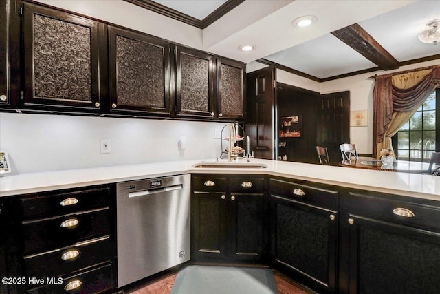 kitchen featuring dark cabinets, a sink, light countertops, ornamental molding, and stainless steel dishwasher