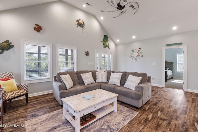 living area with high vaulted ceiling, visible vents, wood finished floors, and recessed lighting