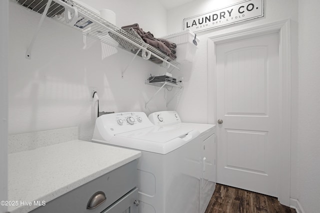 laundry area with dark wood-style floors and independent washer and dryer