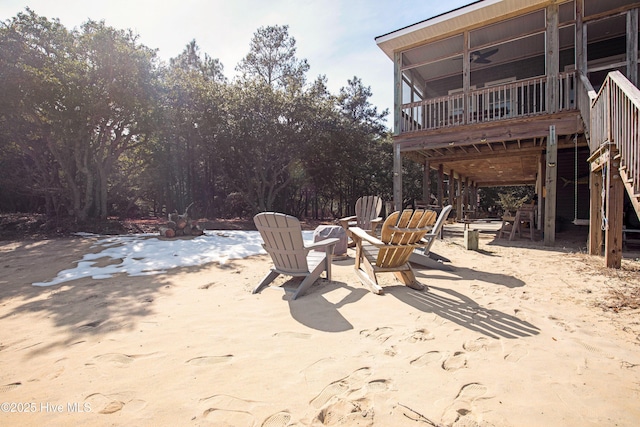 view of patio / terrace with stairs and ceiling fan