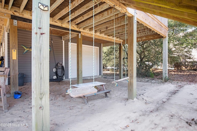 view of patio / terrace with a garage