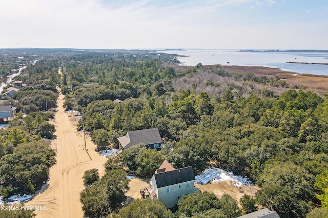 aerial view featuring a water view and a forest view