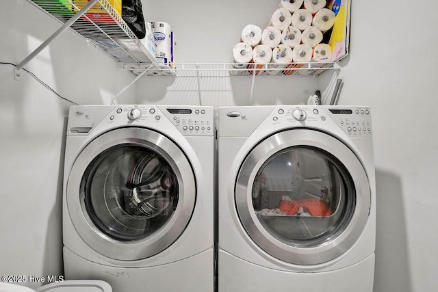 laundry room with washing machine and dryer and laundry area