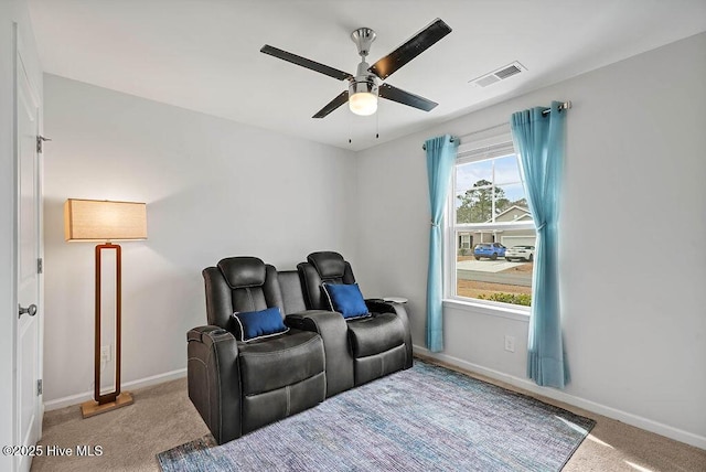 interior space featuring carpet, visible vents, ceiling fan, and baseboards