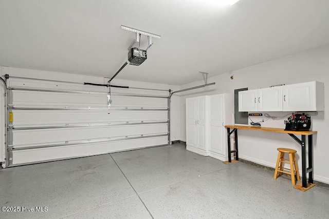 garage featuring baseboards and a garage door opener