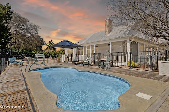 view of pool with a fenced in pool, a patio area, and fence