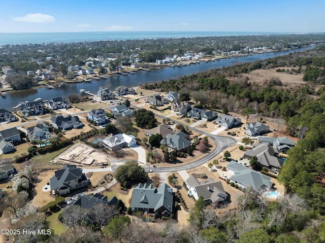 aerial view featuring a residential view and a water view