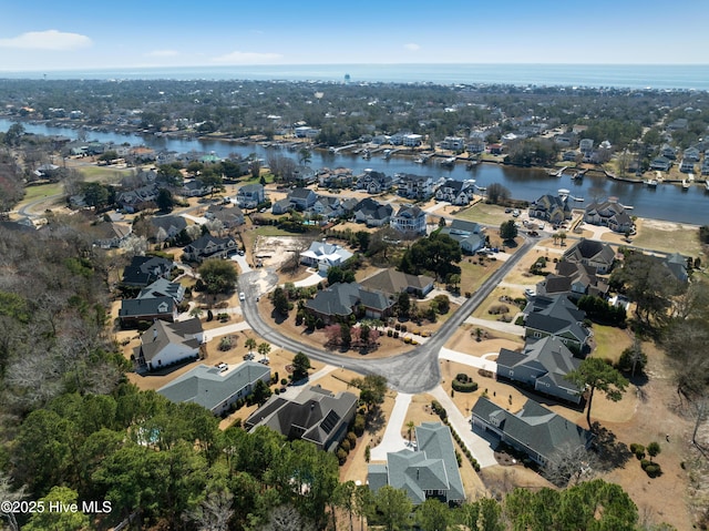 aerial view featuring a residential view and a water view