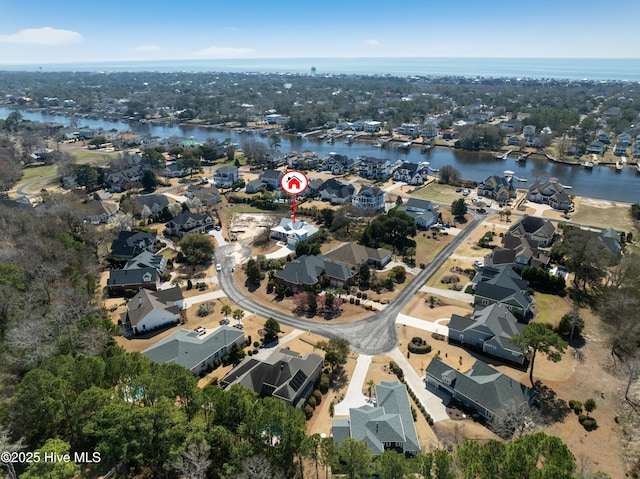 aerial view with a residential view and a water view