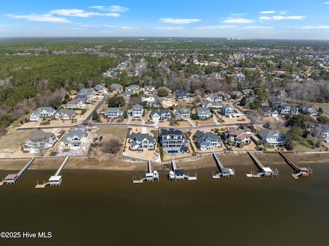 bird's eye view with a residential view and a water view