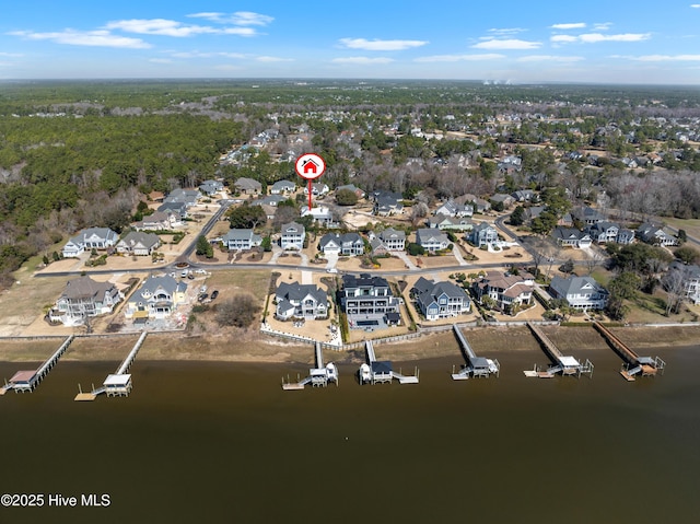 bird's eye view featuring a residential view and a water view