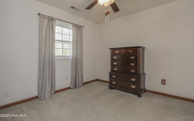 unfurnished bedroom featuring carpet floors, baseboards, and visible vents