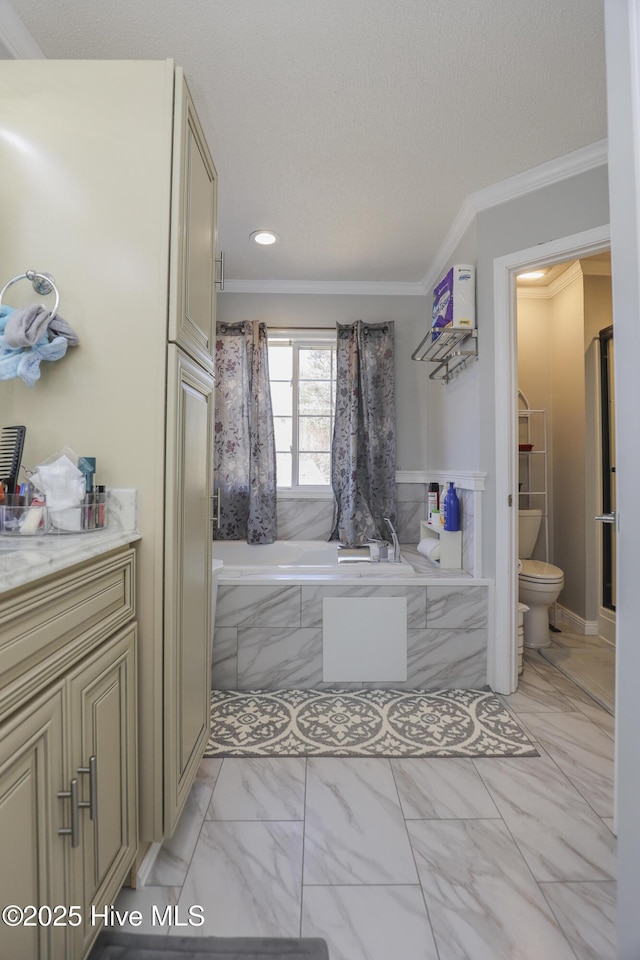 bathroom featuring marble finish floor, tiled bath, curtained shower, toilet, and ornamental molding