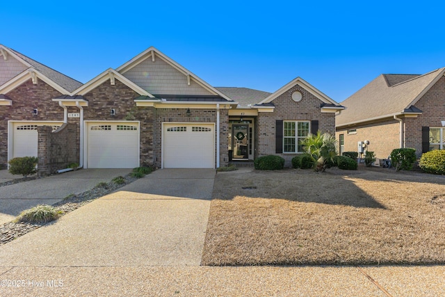 craftsman-style home with brick siding, concrete driveway, and a garage